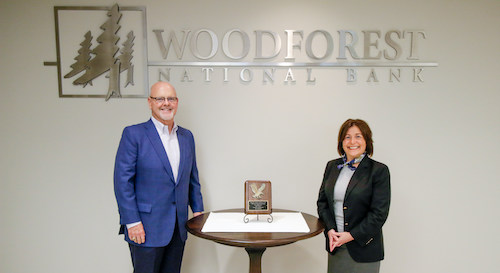 Pictured with the award is Jay Dreibelbis, President and CEO; and Julie V. Mayrant President of the Retail Division with Woodforest National Bank.